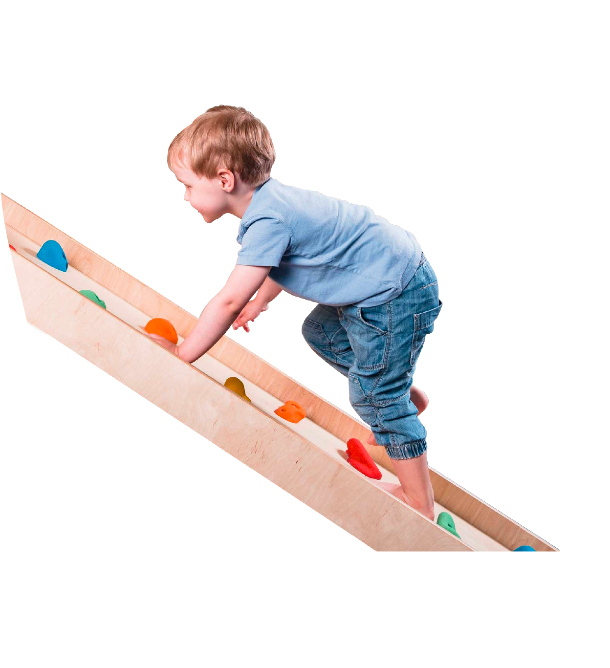 young boy playing on a climbing ramp
